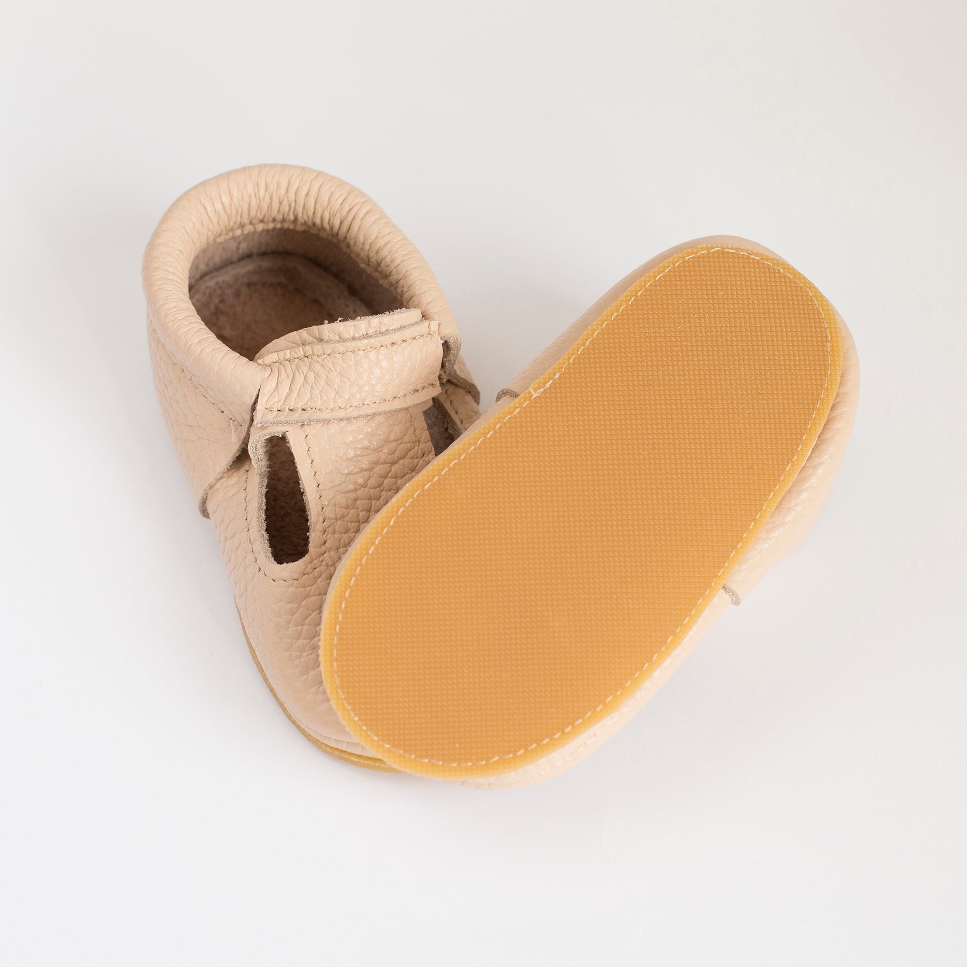 <img src="baby_shoes_with_rubber_sole.jpg" alt="baby shoes with rubber sole">
